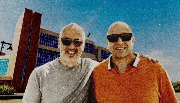 Dominique Romano (left) and Dror Levy (right) in front of the Marina Palace, Cotonou, Benin.