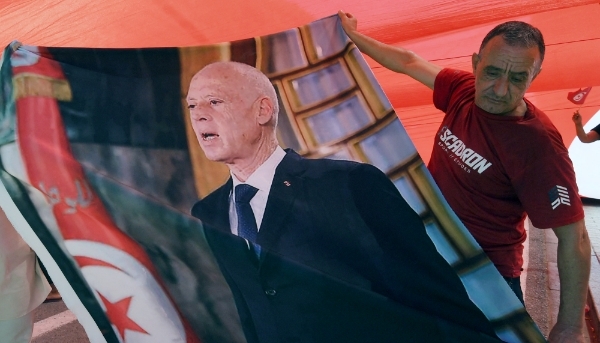 A supporter of Tunisian president Kais Saied during a rally in Tunis on 25 July 2024. 