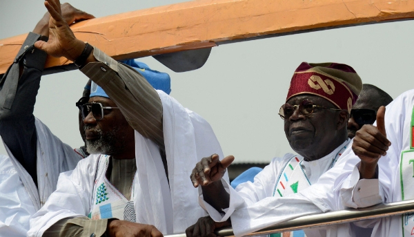 Femi Gbajabiamila and Bola Tinubu on a campaign bus in Lagos, Tuesday 21 February 2023.