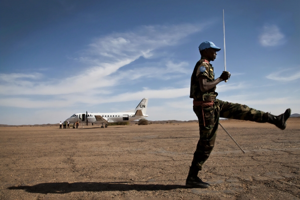 A Chadian MINUSMA soldier parades during a visit by Under-Secretary-General for Peacekeeping Operations Hervé Ladsous to Tessalit, Mali, in March 2013.