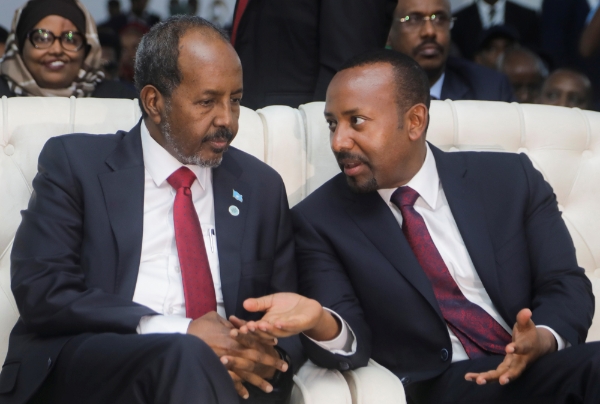 Ethiopia's Prime Minister Abiy Ahmed talks to Somalia's President Hassan Sheikh during his inauguration in Mogadishu, Somalia June 9, 2022.