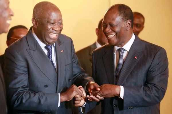 Laurent Gbagbo and Alassane Ouattara during a meeting in Abidjan November 27, 2010.